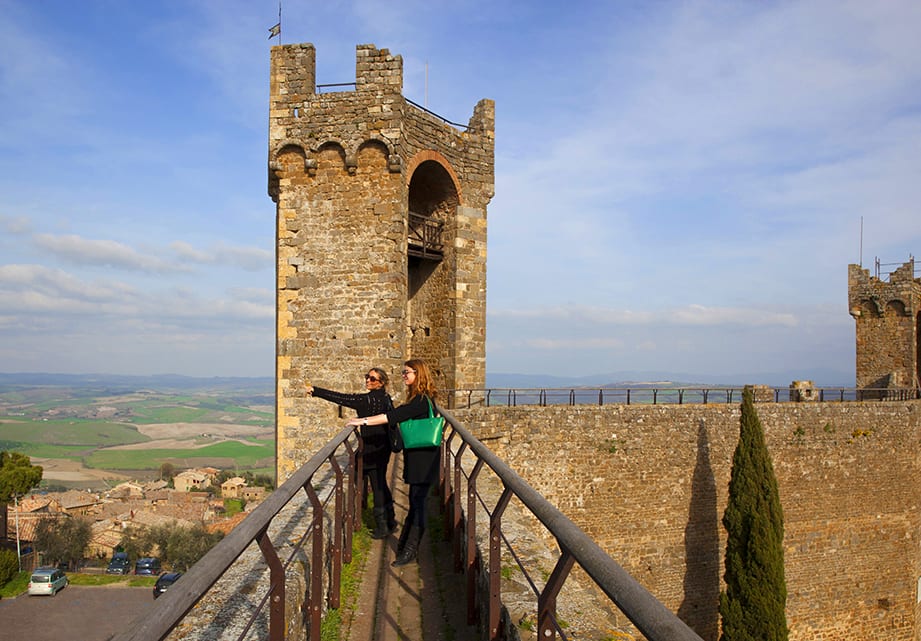 Walk along the walls of Montalcino Castle on our day trip from Tuscany to Rome