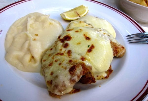 A warm, gooey cotoletta alla valdostana, veal covered in fresh fontina cheese, is the perfect dish after a day touring through the lovely Val d'Aosta Alps. Photo by Jonathan Lin at flickr