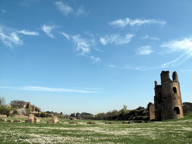 The view across the circus of Maxentius near his villa on the Via Appia Antica, showing the still-standing brick towers on the western end of the circus. Photo from the Institute for the Study of the Ancient World as part of the Ancient World Image Bank 