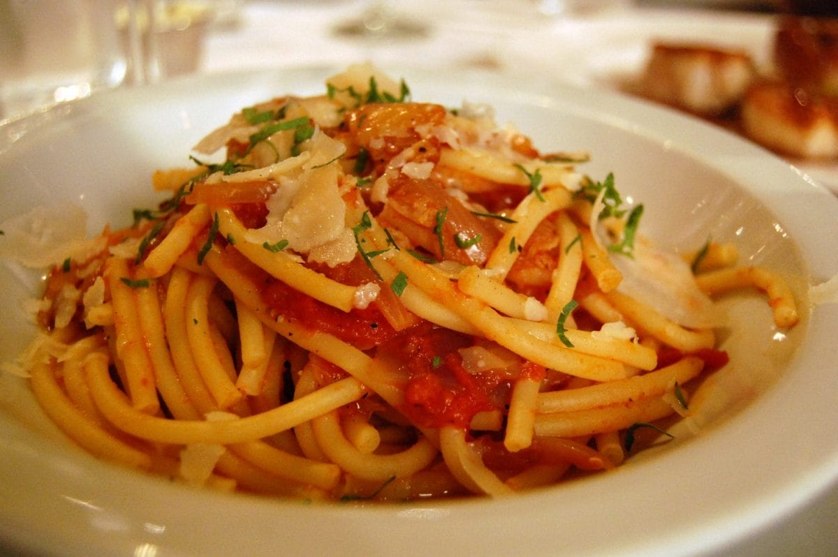 bowl of Bucatini pasta with toppings