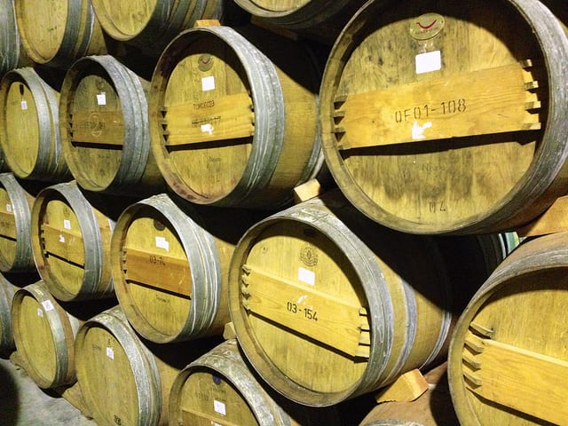 Many of the best Italian wines are aged in white oak barrels like these | photo by Jon Connell via Flickr https://www.flickr.com/photos/ciamabue/9536003395/in/photolist-fwEvzD-Ah6mTz-ANXLsy-aN43Wk-8XHtHL-qwfDN2-q1fVFT-fjopij-jWdbRH-bQ6esp-bvyKQ5-afKW6M-cw1A43-apT1ER-aDdxRj-aDdyaL-9B5271-9oTCM9-aDbmYZ-9KjSiD-9KnGc7-cU5XxN-9KnG1m-aDf8S9-iAPqNu-gnr2d9-AxZsp6-fFiErQ-hVteBd-67afaP-hen7V9-67fjnS-7QpqY4-7Qpr36-dAp97v-aDmo2C-aDmog3-aDfebQ-aDbnbn-aDf8FS-aDhgQH-67ftZL-9KoFA1-rdq2hA-dU9K6S-djn4yv-dAp9UP-afuNeq-4wBSgJ-rHPs2m