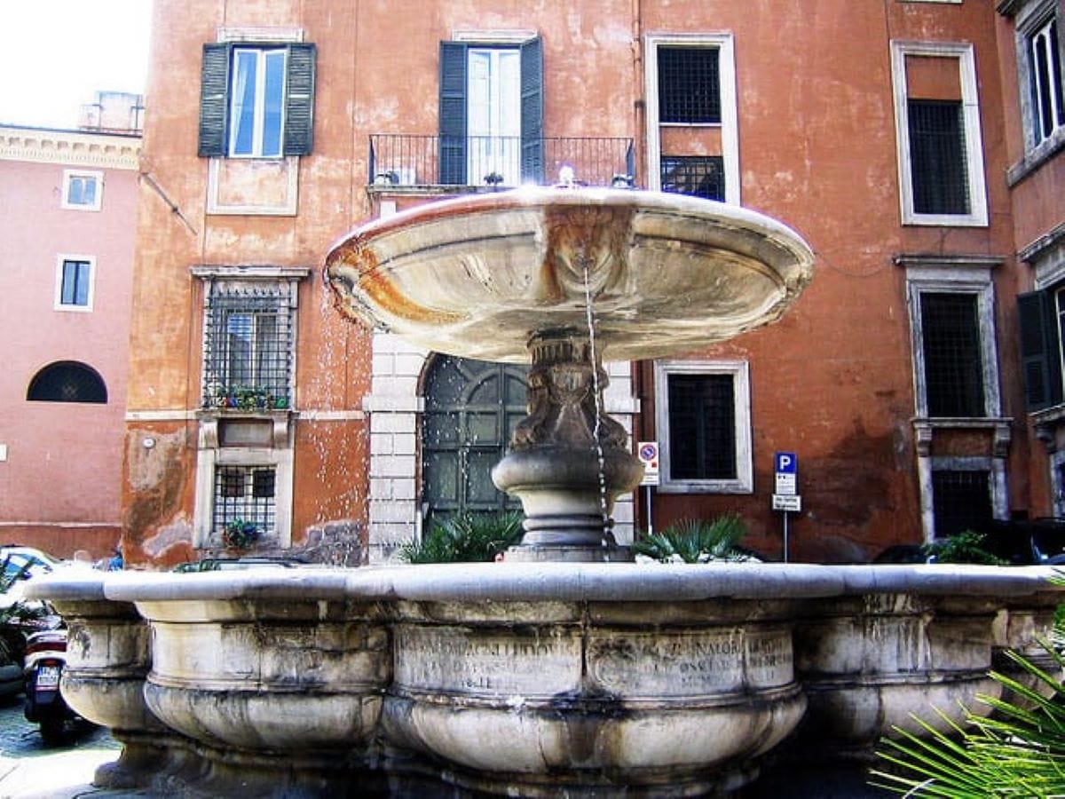 large fountain in middle of italian street