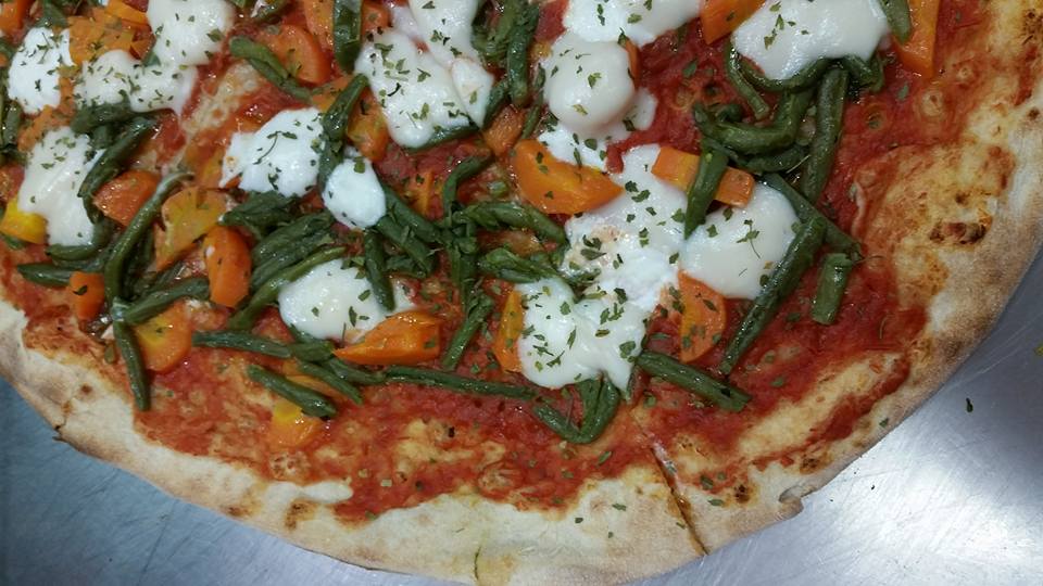 pizza with vegetables and globs of mozzarella