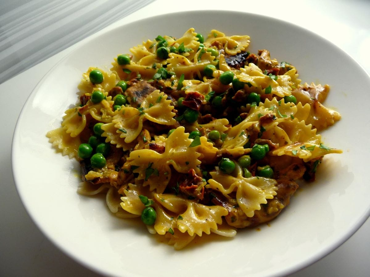 plate of farfalle pasta with peas