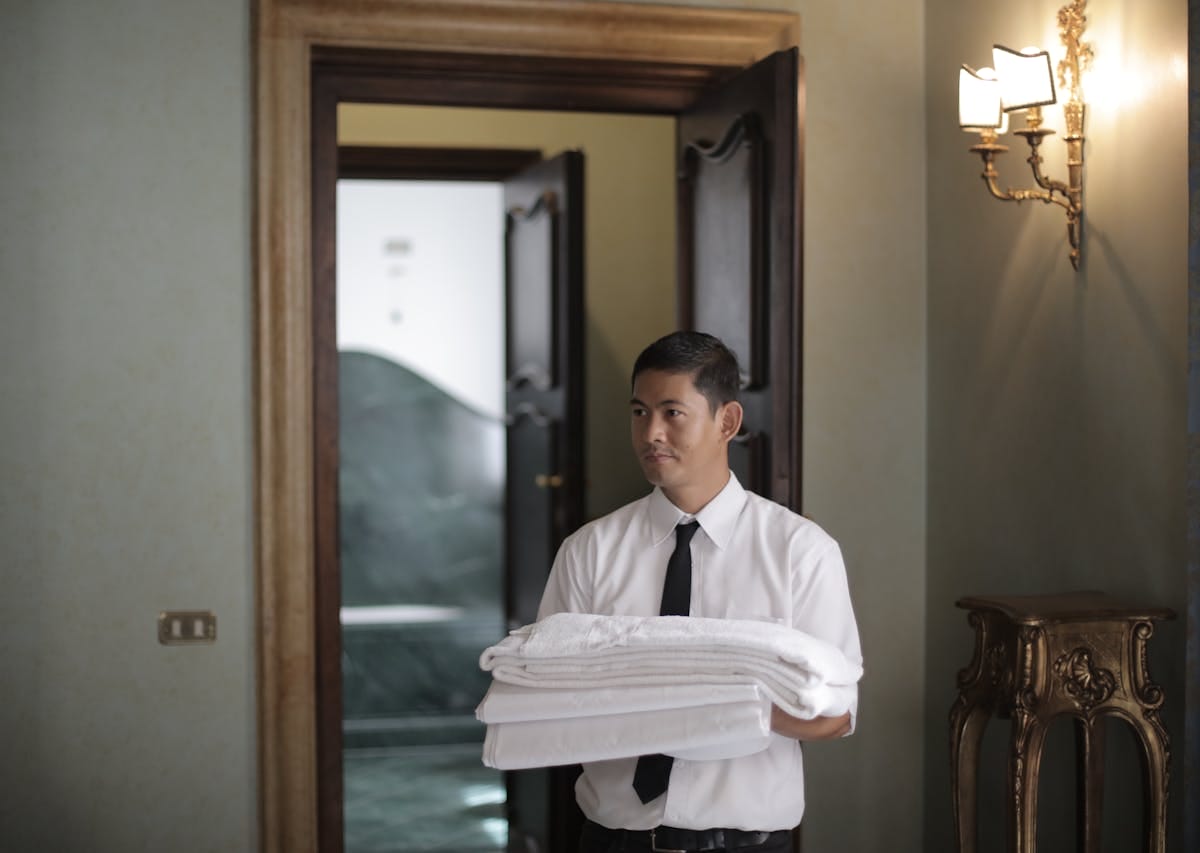 Hotel staff bringing some towels