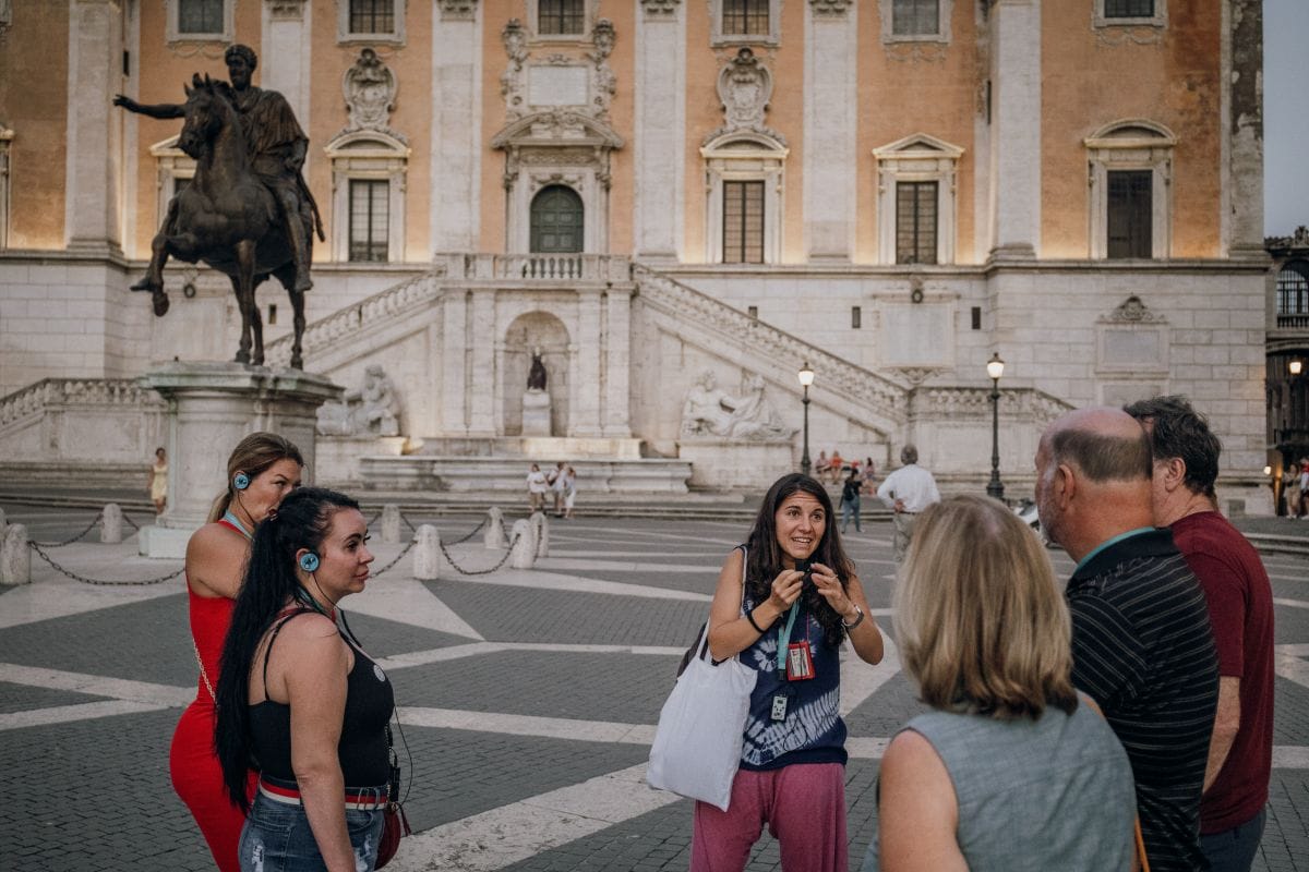 People exploring Rome at night. 