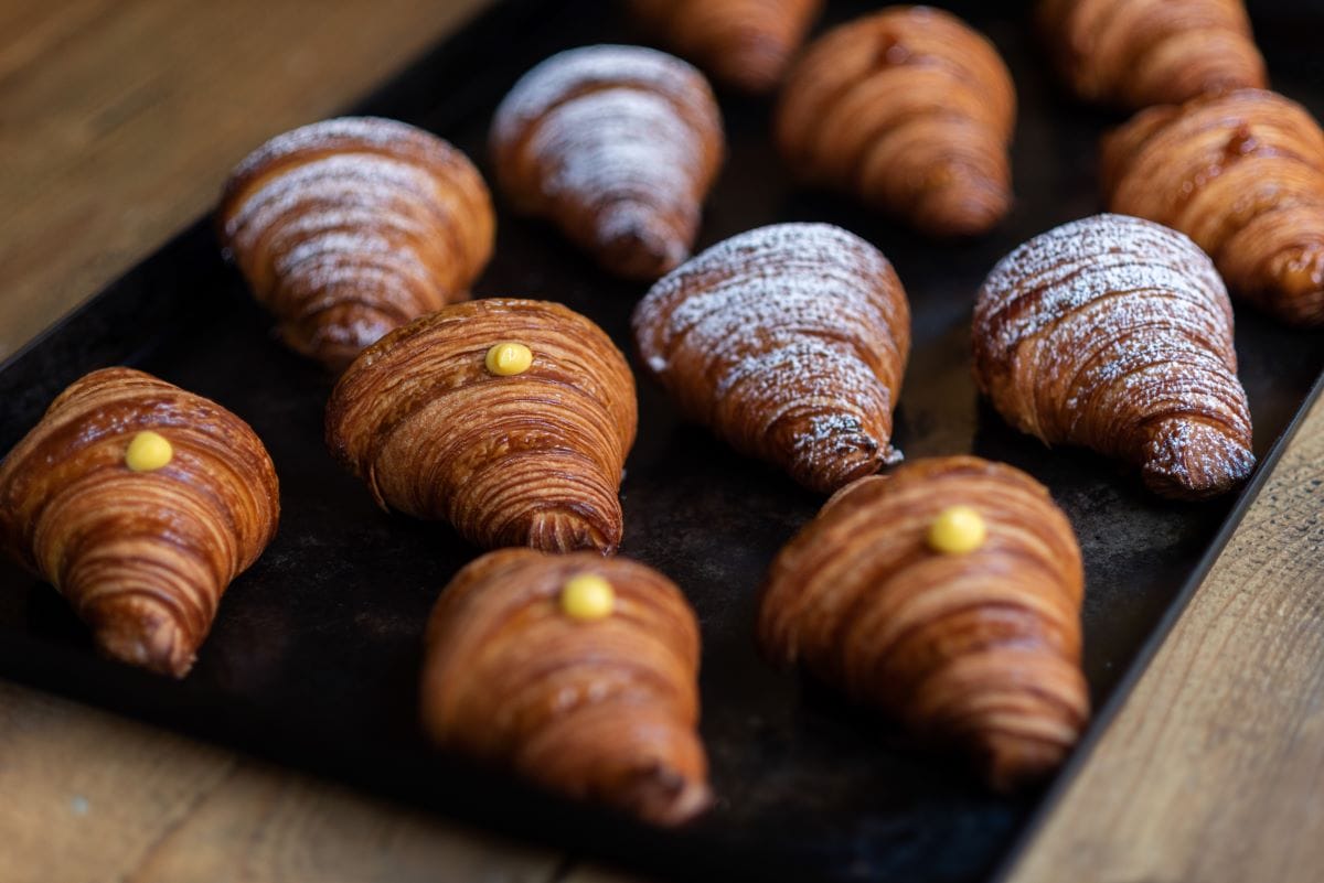 tray covered in various croissants