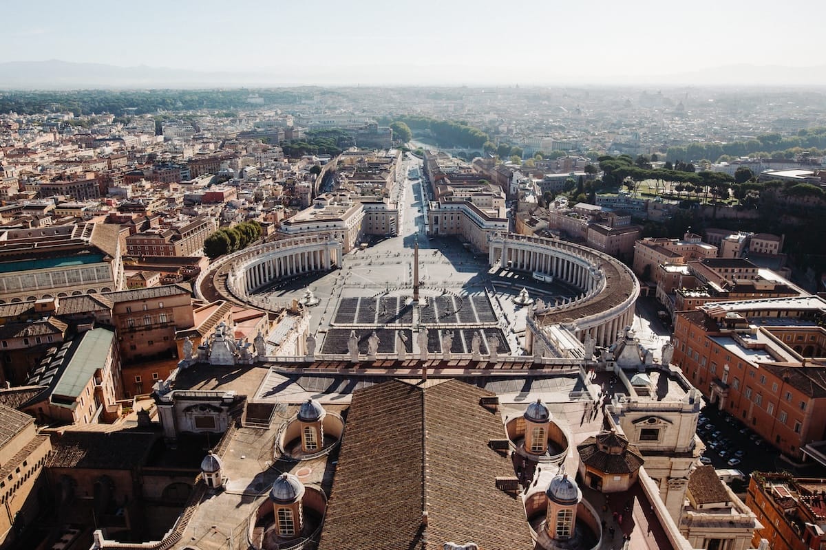 aerial view of large rounded square at St. Peter's Basilica filled with people