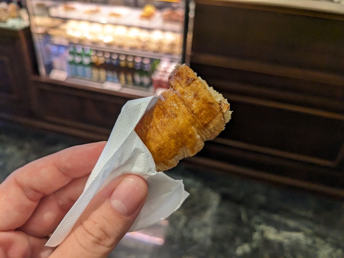 hand holding a cone-shaped pastry