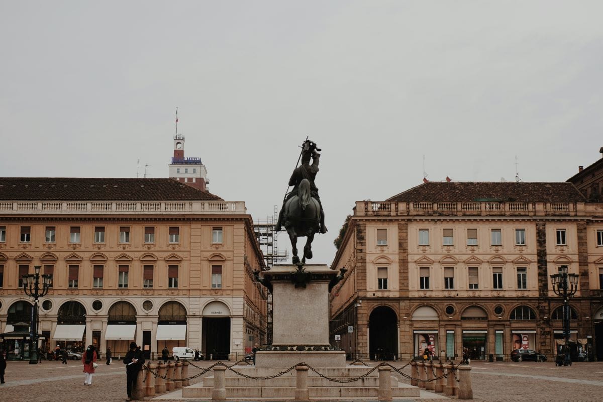 statue of large horse in the middle of Italian square