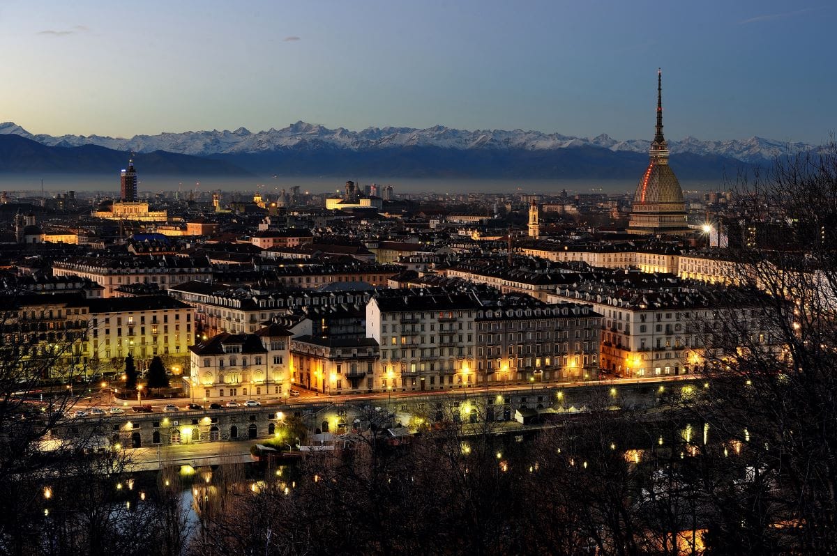 view of city in evening time with mountains in the background