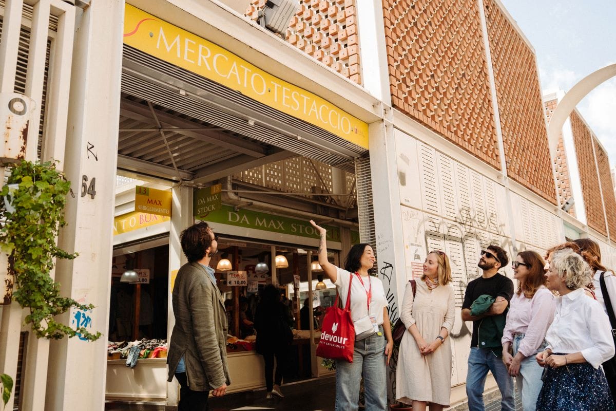 people standing outside an Italian market called mercato testaccio