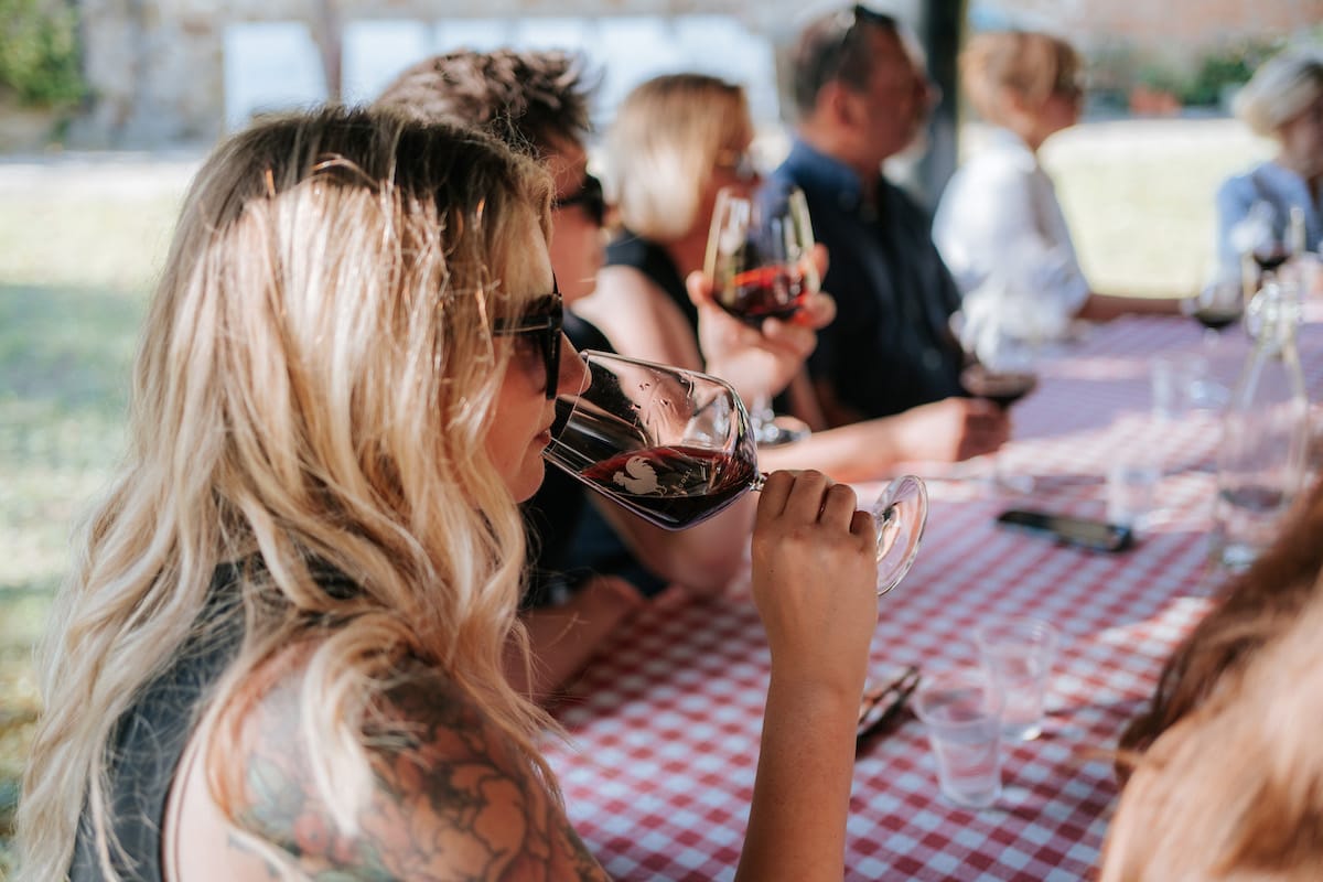 Group sipping red wine Chianti