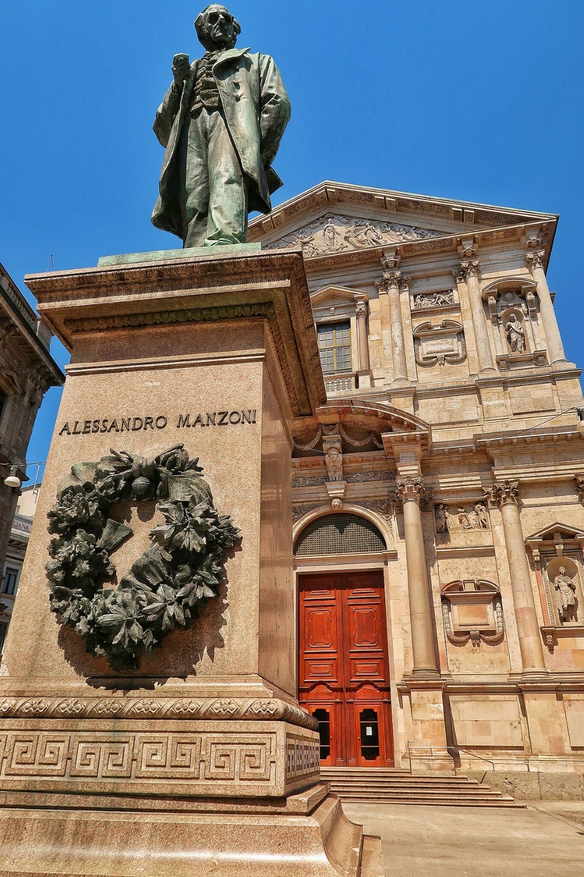 A statue of Alessandro Manzoni in Piazza San Fedele.