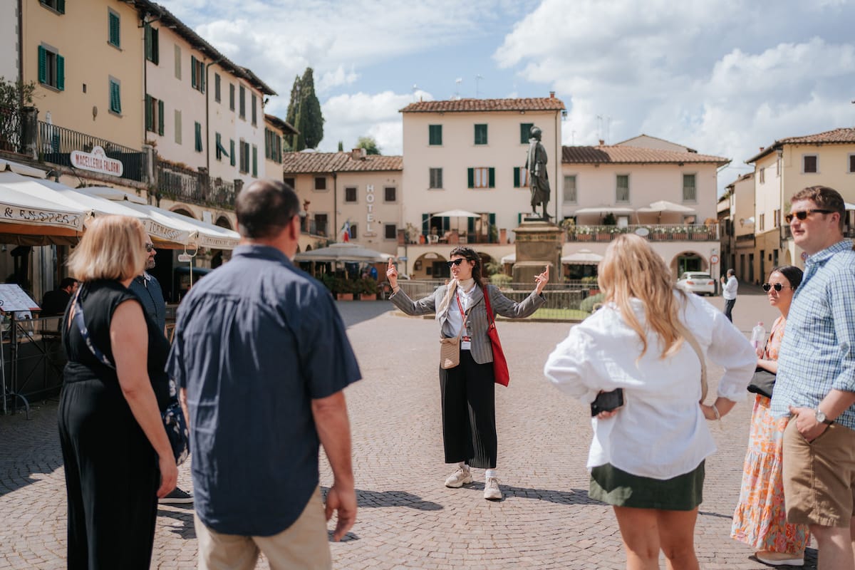 Tour guide talking to a group about the city