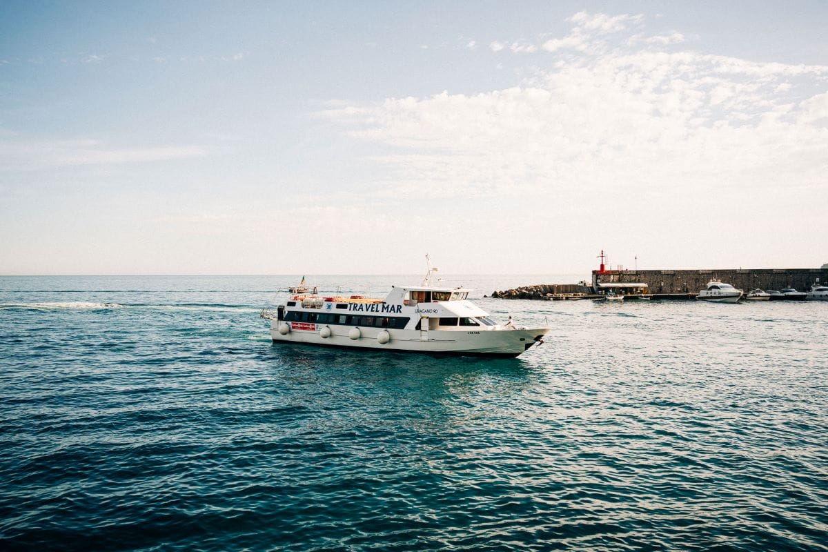 a white boat with the name travelmar in the sea